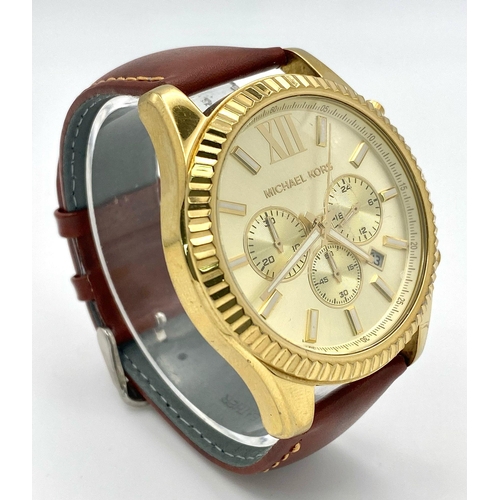 883 - A Designer Michael Kors Chronograph Gents Watch. Brown leather strap. Gilded case - 45mm. Cream dial... 