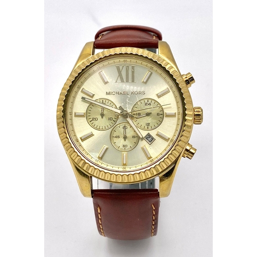 883 - A Designer Michael Kors Chronograph Gents Watch. Brown leather strap. Gilded case - 45mm. Cream dial... 