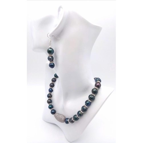 213 - A glamorous Tahitian, black pearl necklace and earrings set highlighted with cubic zirconia. Large 1... 