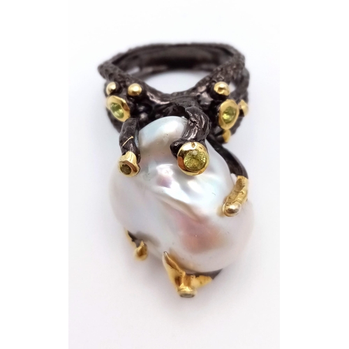 291 - A vintage sterling silver (with black patina) ring with a massive baroque, white, natural pearl and ... 