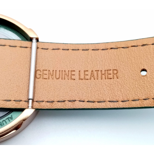 344 - A Verticale Mechanical Top Winder Gents Watch. Green leather strap. Gold  tone ceramic gilded skelet... 