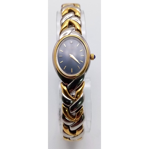 388 - A Seiko Quartz Ladies Watch. Two tone strap and case - 19cm. Blue dial. In good condition and workin... 