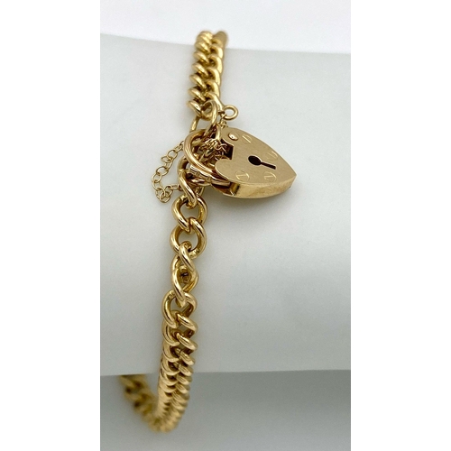 162 - A 9K Yellow Gold Small Curb Link Bracelet with Heart Clasp. 
17cm. 7.45g weight.