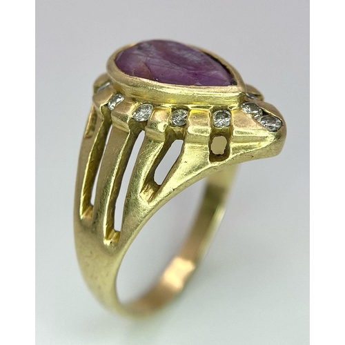 249 - A Vintage 14K Yellow Gold Amethyst and Diamond Ring. Teardrop central amethyst with a diamond surrou... 