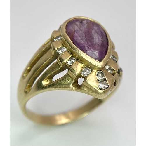 249 - A Vintage 14K Yellow Gold Amethyst and Diamond Ring. Teardrop central amethyst with a diamond surrou... 