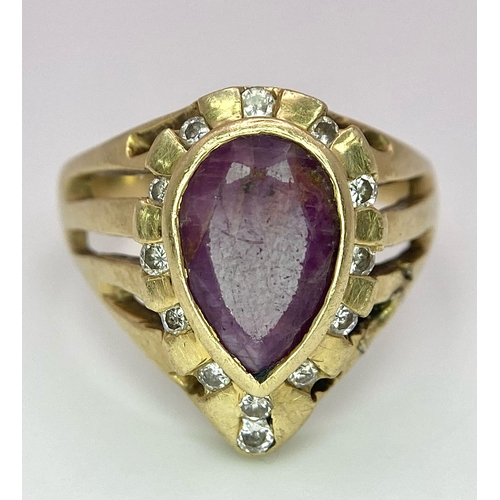 249 - A Vintage 14K Yellow Gold Amethyst and Diamond Ring. Teardrop central amethyst with a diamond surrou... 