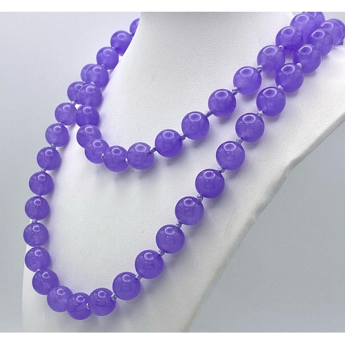 444 - A Matinee Length Lavender Jade Beaded Necklace. 12mm beads. 88cm necklace length.