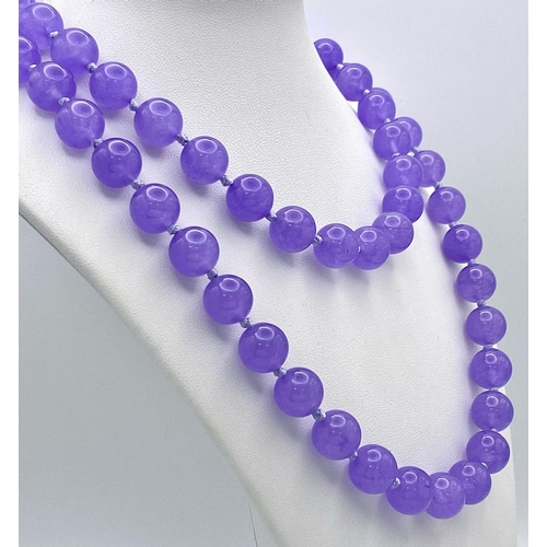 444 - A Matinee Length Lavender Jade Beaded Necklace. 12mm beads. 88cm necklace length.