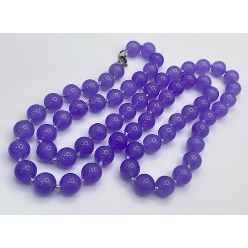 444 - A Matinee Length Lavender Jade Beaded Necklace. 12mm beads. 88cm necklace length.