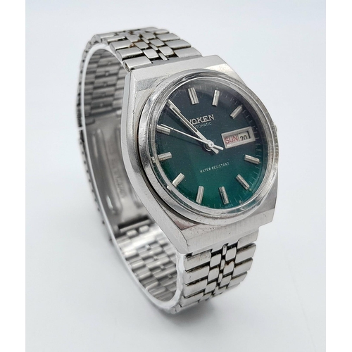 1456 - A Vintage Voken Automatic Gents Watch. Stainless steel bracelet and case - 37mm. Green dial with day... 