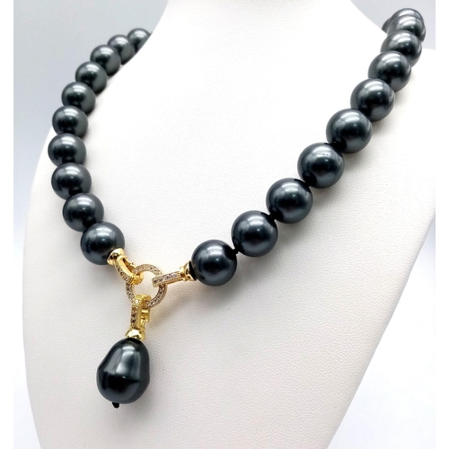 519 - A Metallic Dark Grey South Sea Pearl Shell Necklace with a Teardrop Pendant. 14mm large beads. Gilde... 