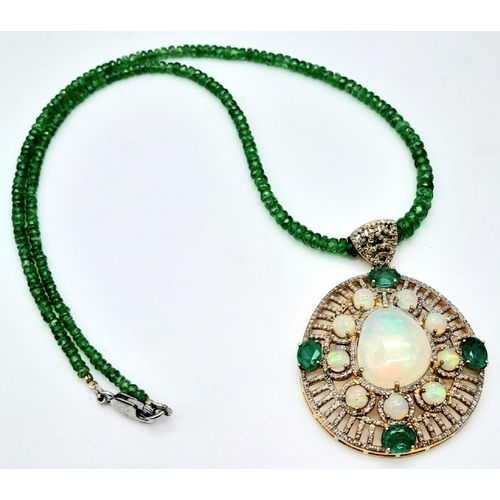 101 - A Fancy Opal, Diamond and Emerald Pendant with a Detachable Green Garnet Necklace. Centre opal with ... 