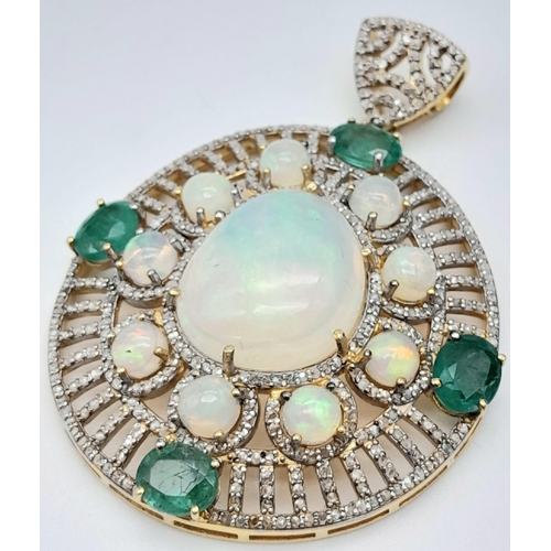 101 - A Fancy Opal, Diamond and Emerald Pendant with a Detachable Green Garnet Necklace. Centre opal with ... 