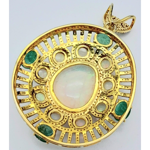 101 - A Fancy Opal, Diamond and Emerald Pendant with a Detachable Green Garnet Necklace. Centre opal with ... 