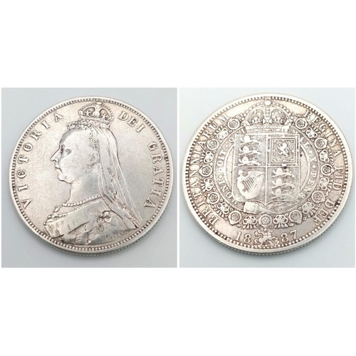 1570 - An 1887 Queen Victoria Silver Half Crown Coin. VF grade but please see photos.