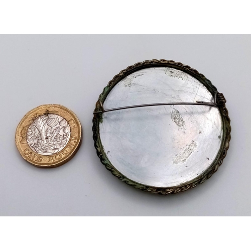 1571 - A Russian Mother of Pearl Hand-Made Brooch. 5cm diameter.