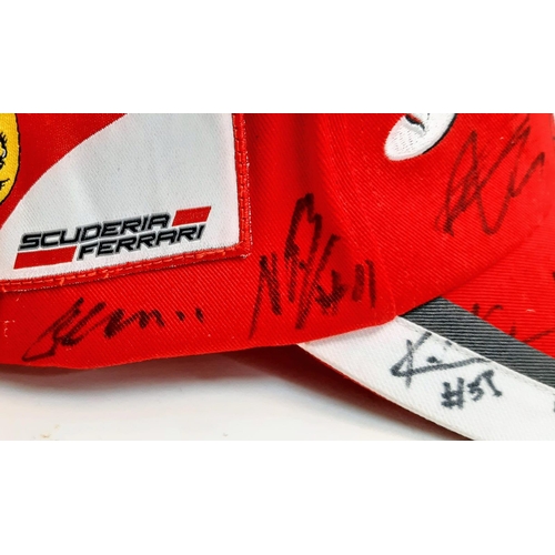 394 - An Official Ferrari Team Cap - Over 20 signatures including Ferrari drivers and team principals. Ple... 