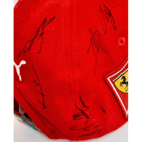 394 - An Official Ferrari Team Cap - Over 20 signatures including Ferrari drivers and team principals. Ple... 