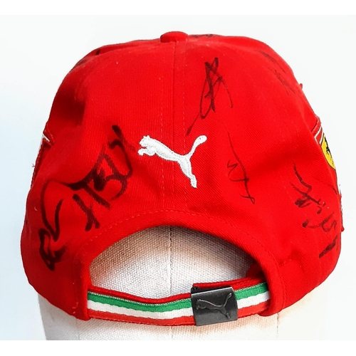 394 - An Official Ferrari Team Cap - Over 20 signatures including Ferrari drivers and team principals. Ple... 