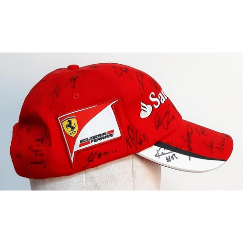 394 - An Official Ferrari Team Cap - Over 20 signatures including Ferrari drivers and team principals. Ple... 