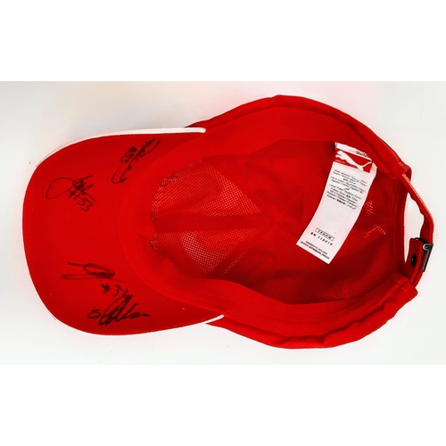 394 - An Official Ferrari Team Cap - Over 20 signatures including Ferrari drivers and team principals. Ple... 