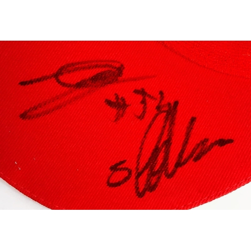 394 - An Official Ferrari Team Cap - Over 20 signatures including Ferrari drivers and team principals. Ple... 