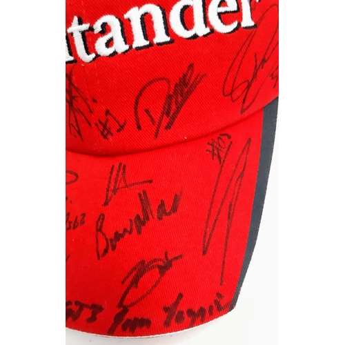 394 - An Official Ferrari Team Cap - Over 20 signatures including Ferrari drivers and team principals. Ple... 