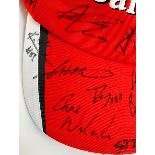 394 - An Official Ferrari Team Cap - Over 20 signatures including Ferrari drivers and team principals. Ple... 