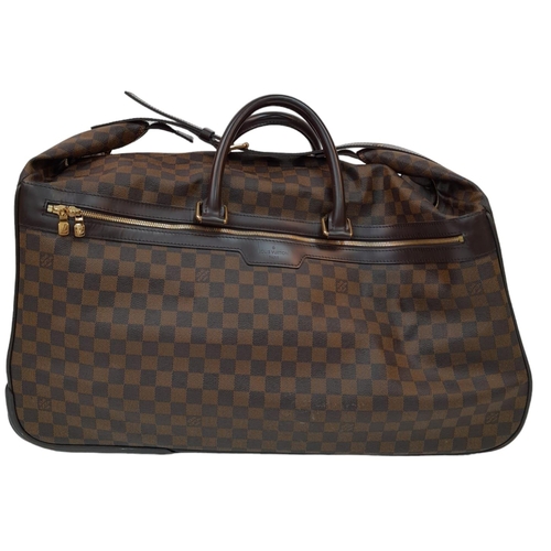 739 - A Louis Vuitton Damier Ebene Eole Convertible Travel Bag. Leather exterior with gold-toned hardware,... 