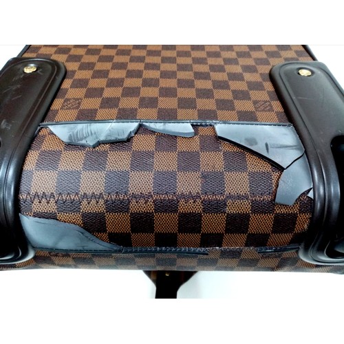 739 - A Louis Vuitton Damier Ebene Eole Convertible Travel Bag. Leather exterior with gold-toned hardware,... 