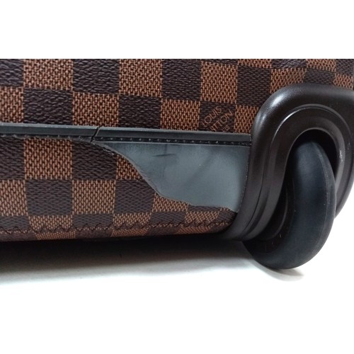 739 - A Louis Vuitton Damier Ebene Eole Convertible Travel Bag. Leather exterior with gold-toned hardware,... 