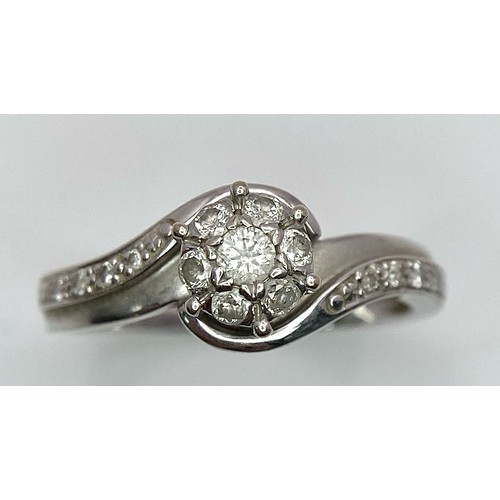 1284 - A 9K WHITE GOLD 0.25CT DIAMOND CLUSTER RING. TOTAL WEIGHT 2.4G. SIZE L