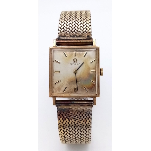 683 - A Vintage Omega 9K Gold Cased Gents De Ville Watch. 620 calibre. Gilded stainless steel bracelet. 9K... 