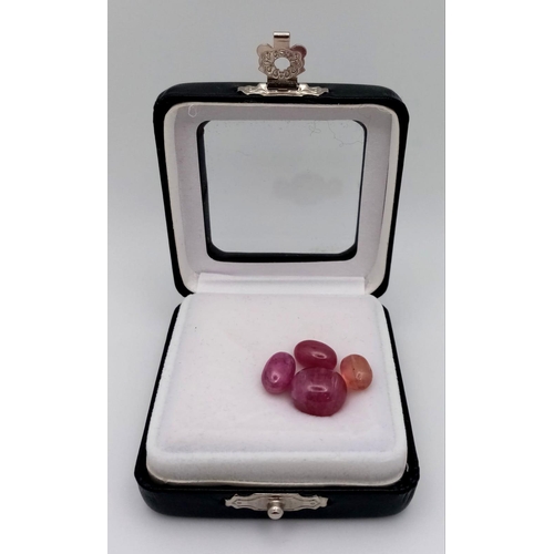 689 - A 26.25ctw Lot of African Ruby Gemstones. Four stones in a clip-open case.