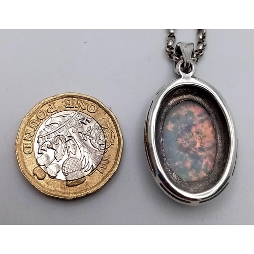 A Wonderful Colour-Play Oval Opal Silver Pendant on a 925 Small Belcher ...