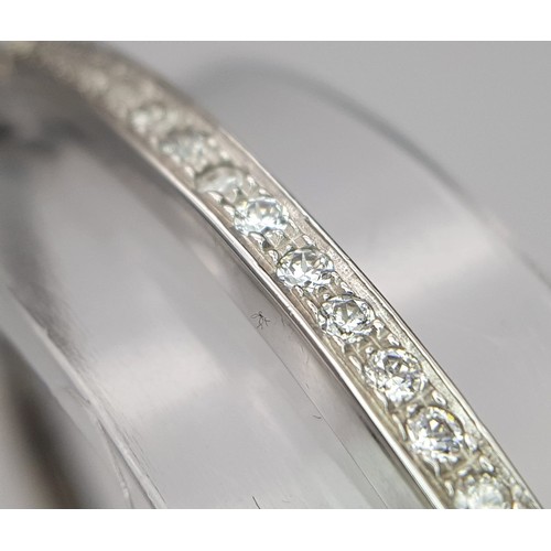 126 - A 14K WHITE GOLD AND DIAMOND SECTIONED BRACELET WITH SAFETY CATCH  .   13.8gms