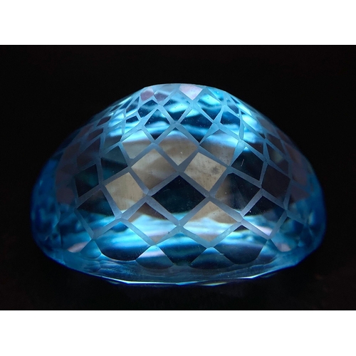 682 - A 92.96ct Blue Topaz Gemstone, in Oval Flower Laser Cut. Comes with the GFCO Swiss Certificate