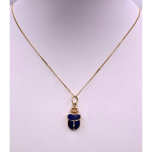 180 - A 9KT Yellow Gold Necklace with an Egyptian Hallmarked 9KT Gold Scarab Pendant. Scarabs are universa... 