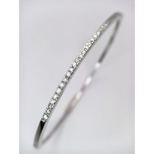 95 - Superb 18kt White Gold, Diamond Set Bangle.
With a safety, hinge release this beautiful bangle measu... 