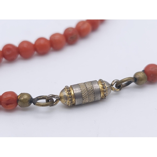 82 - A Graduating Vintage Orange Coral Beaded Necklace.
Measures 48cm in length with a vintage twist clas... 