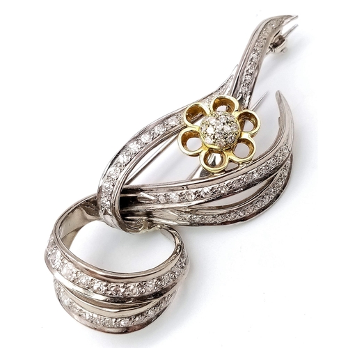 455 - Diamond encrusted 18kt White & Yellow Gold Brooch.
Beautifully woven White Gold design, adorned with... 