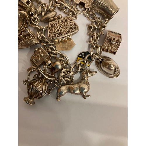 105 - Vintage SILVER CHARM BRACELET Full of interesting and unusual SILVER CHARMS. Please see all pictures... 