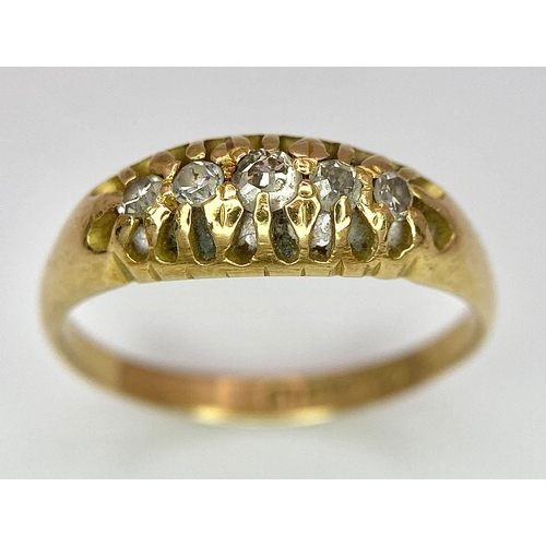 107 - An 18 K yellow gold ring with a band of five diamonds, size: O, weight: 3.2 g.