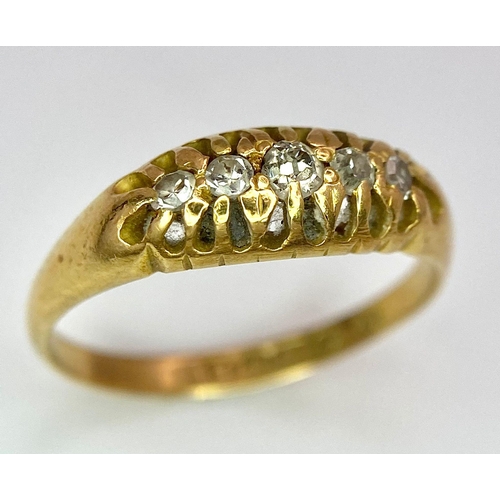 107 - An 18 K yellow gold ring with a band of five diamonds, size: O, weight: 3.2 g.