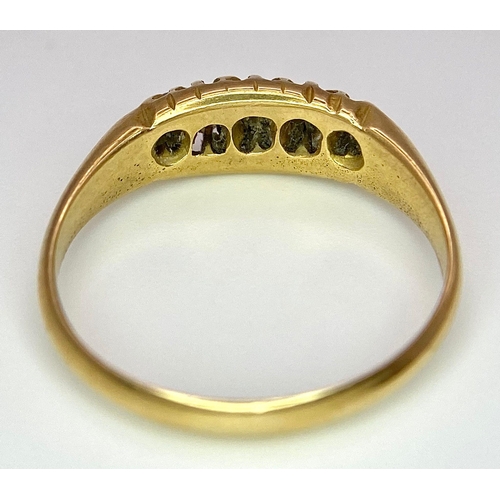 107 - An 18 K yellow gold ring with a band of five diamonds, size: O, weight: 3.2 g.