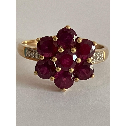 140 - 9 carat GOLD,DIAMOND and TOURMALINE RING. Having Tourmaline gemstones set to top  in a floral cluste... 