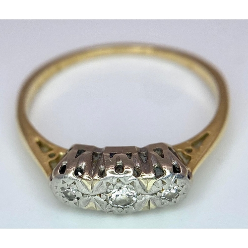 142 - An 18 K yellow gold ring with a trilogy of diamonds, size: K1/2, weight: 1.9 G.