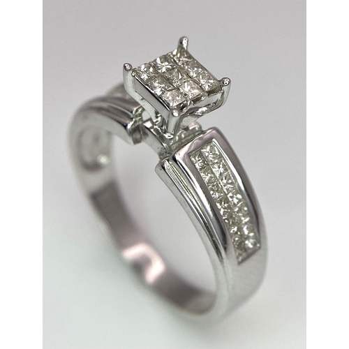 194 - A 14K White Gold Diamond Ring. Nine small central squares with diamond squares on shoulders. 0.50ctw... 