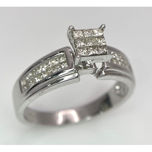 194 - A 14K White Gold Diamond Ring. Nine small central squares with diamond squares on shoulders. 0.50ctw... 