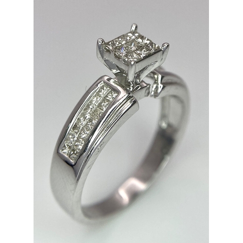 194 - A 14K White Gold Diamond Ring. Nine small central squares with diamond squares on shoulders. 0.50ctw... 